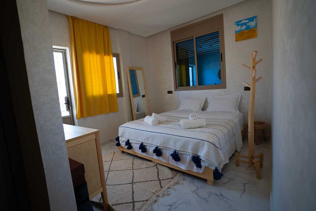 Surf Camp vs Surf Retreat vs Surf Hotel in Morocco: Which Experience Is Right for You? 3 Private double room with balcony at The Happy Surfers surf camp in Tamraght