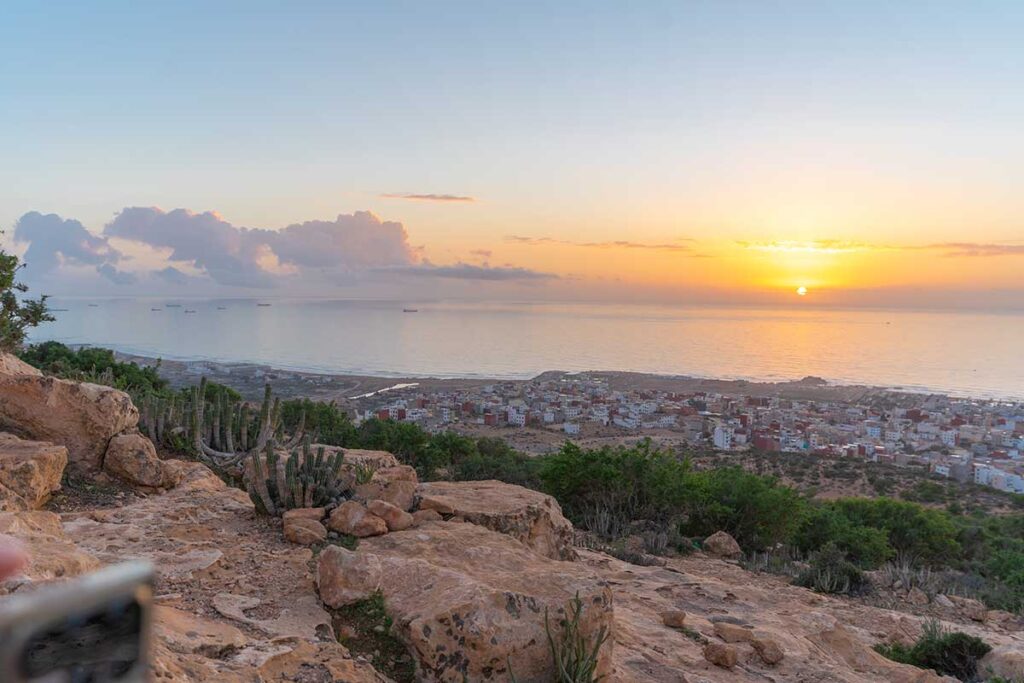 Best surf spots in Morocco for Beginners - 2026 Complete Guide 3 Sunset view over Tamraght village and the Atlantic Ocean from the hills above Tamraght, Morocco