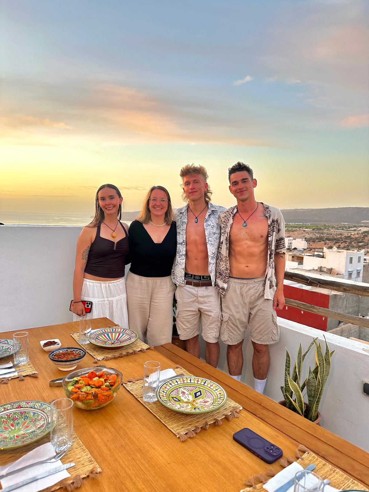 Group of friends at sunset dinner.